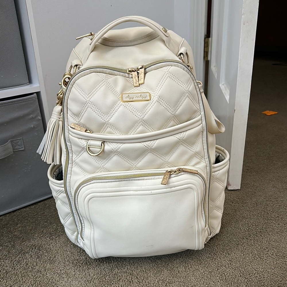Itzy Ritzy Cream Baby Bag with Tassel Detail